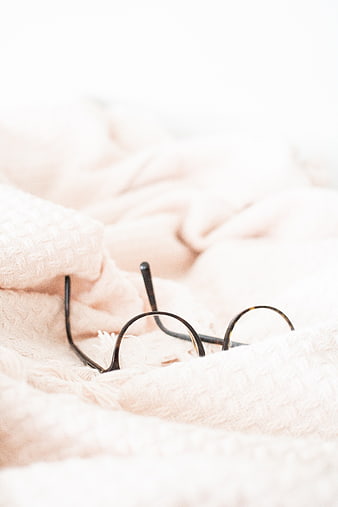 Cozy Glasses on Soft Pink Blanket