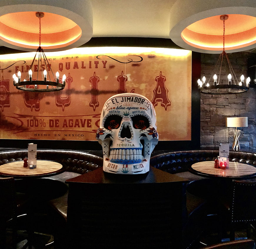 Decorative Sugar Skull Tequila Bottle in Restaurant Interior