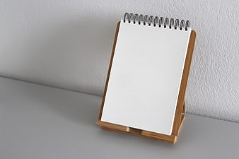 Blank Spiral Notebook on Wooden Stand Mockup