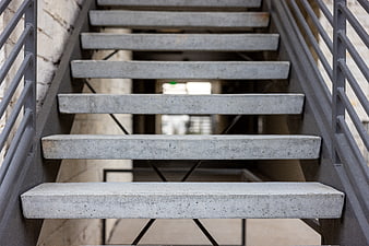 Modern Concrete Staircase with Metal Railings