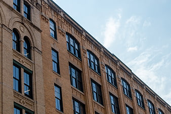 Low Angle View of Historic Brick Building with Arched Windows