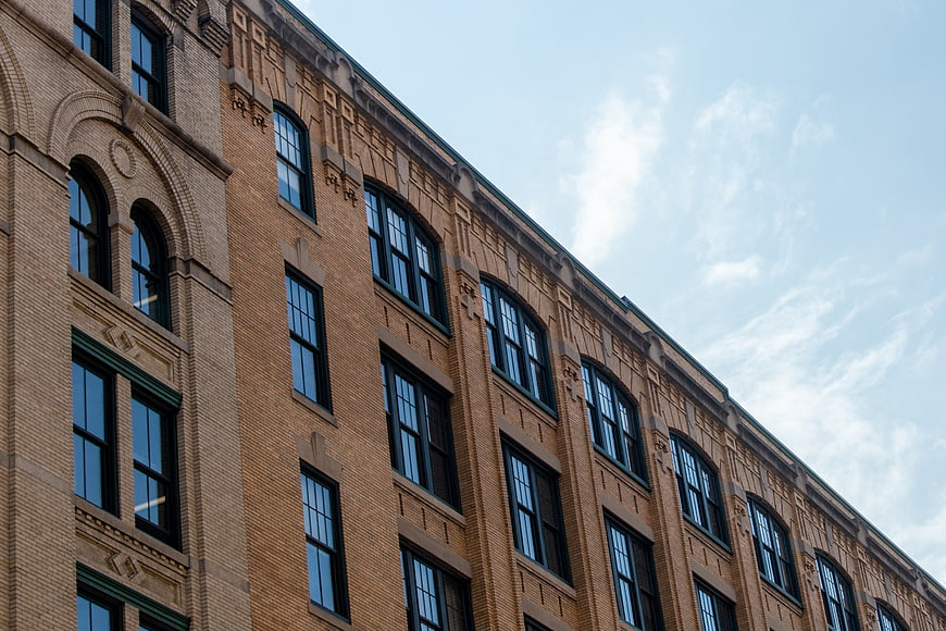 Low Angle View of Historic Brick Building with Arched Windows