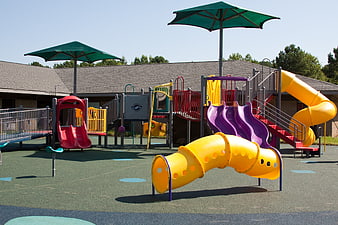 Colorful Empty Playground with Slides and Climbing Structures