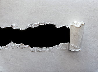 Torn white paper texture with black void and rolled edge