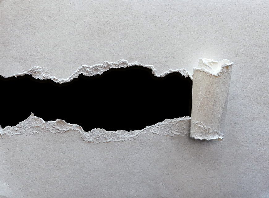 Torn white paper texture with black void and rolled edge
