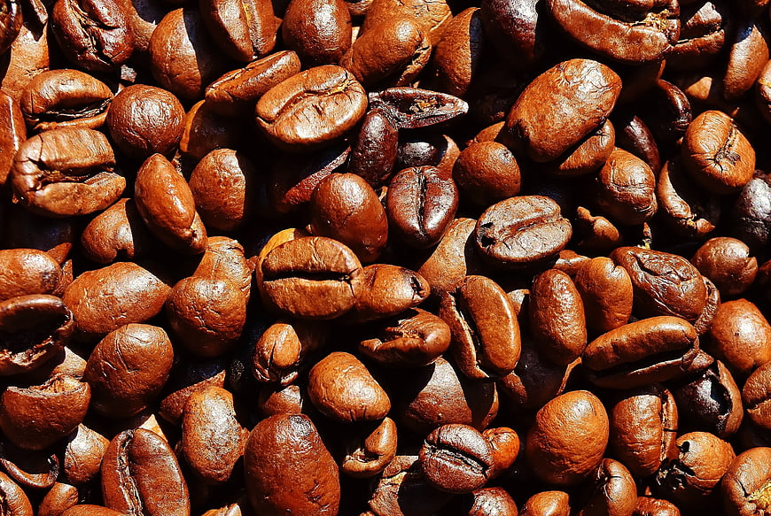 Close-up of roasted brown coffee beans texture