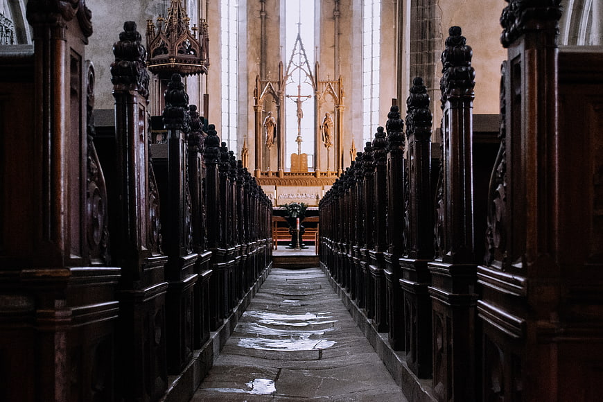 Gothic Church Interior with Wooden Pews and Altar