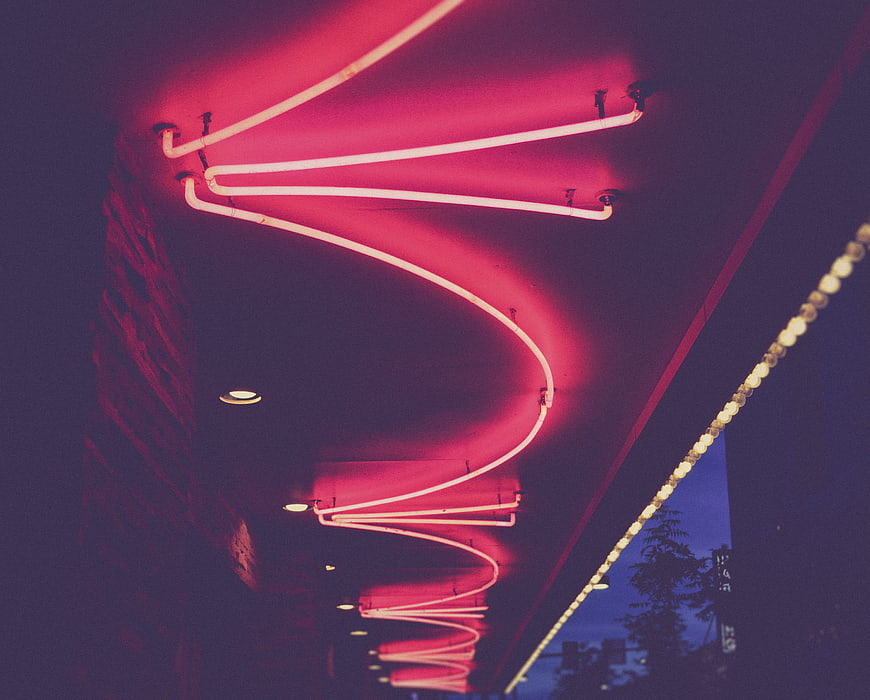 Abstract Pink Neon Light Tubes on Dark Ceiling