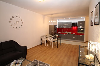 Modern Apartment Interior with Red Kitchen and Dining Area