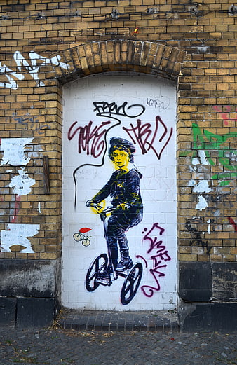 Street Art Mural of Boy on Scooter on Brick Wall