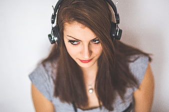Young Woman Listening to Music with Headphones