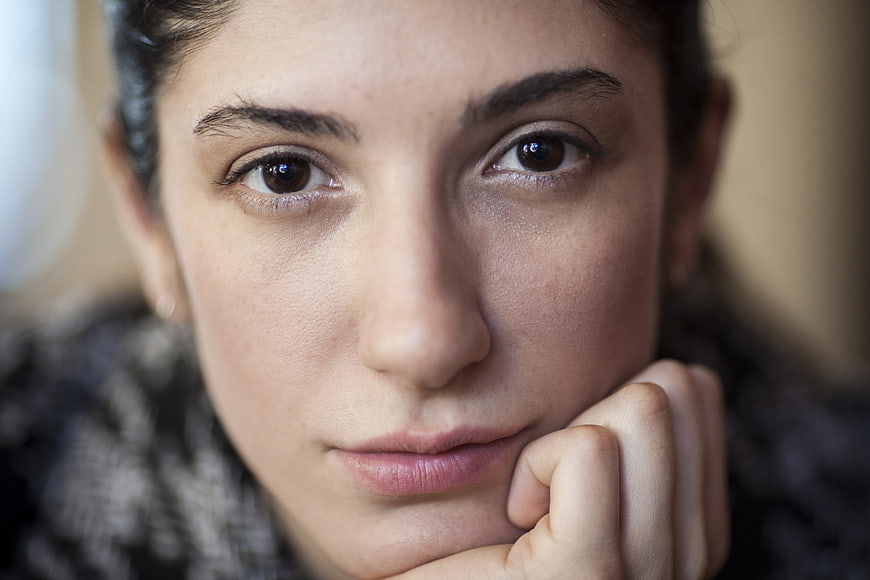 Close-up portrait of a young woman with intense gaze