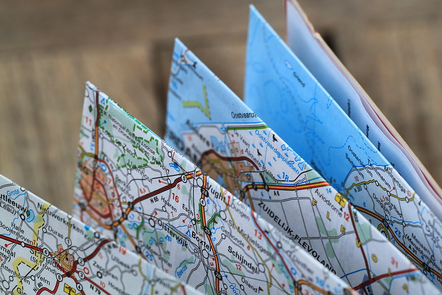 Folded paper road map with city names and routes