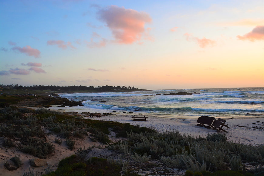 Serene Sunset at Pacific Grove Beach with Wooden Benches