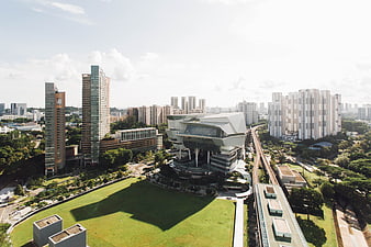 Aerial View of Modern City Architecture with Green Spaces