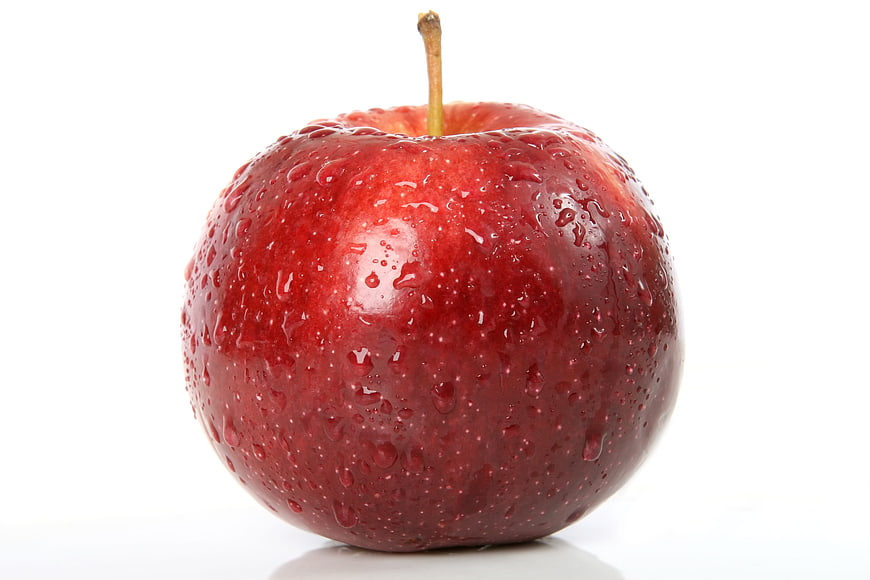Fresh Red Apple with Water Droplets Isolated on White