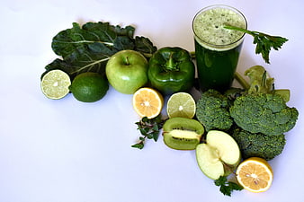 Green Smoothie With Fresh Vegetables And Fruits On White Background