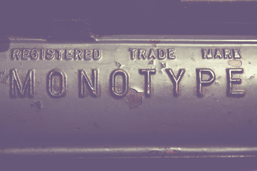 Vintage Monotype Metal Stamp Close-Up