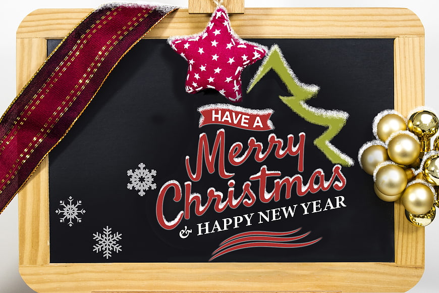 Merry Christmas and Happy New Year chalkboard greeting with festive decorations