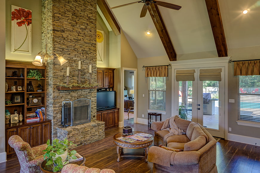 Spacious living room with stone fireplace and vaulted ceiling