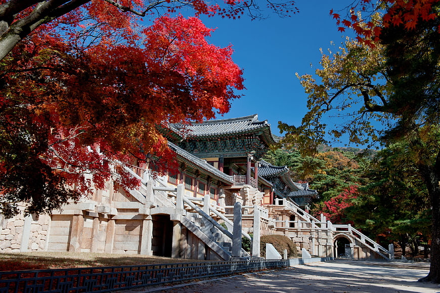 Traditional Korean Temple in Vibrant Autumn Foliage