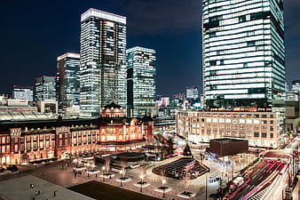 Tokyo Station Night View with Modern Skyscrapers and Light Trails