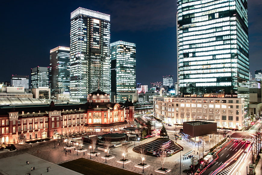 Tokyo Station Night View with Modern Skyscrapers and Light Trails