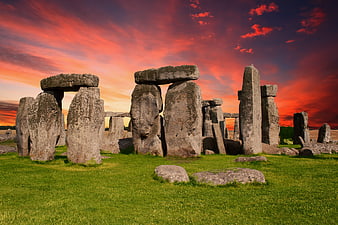 Stonehenge monument under dramatic red sunset sky