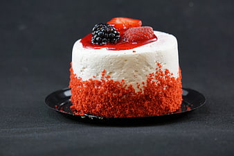 Red Velvet Cheesecake With Fresh Berries On Black Plate