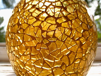 Close-up of golden mosaic glass candle holder