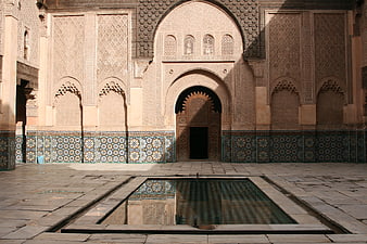 Traditional Moroccan courtyard with ornate zellige tilework and fountain