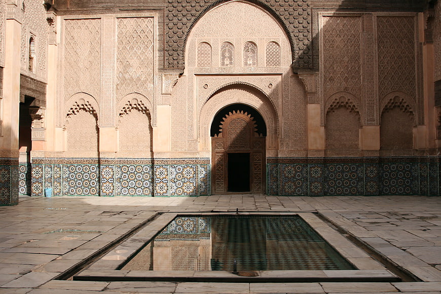 Traditional Moroccan courtyard with ornate zellige tilework and fountain