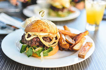 Juicy Beef Burger with Onion Rings and Fries