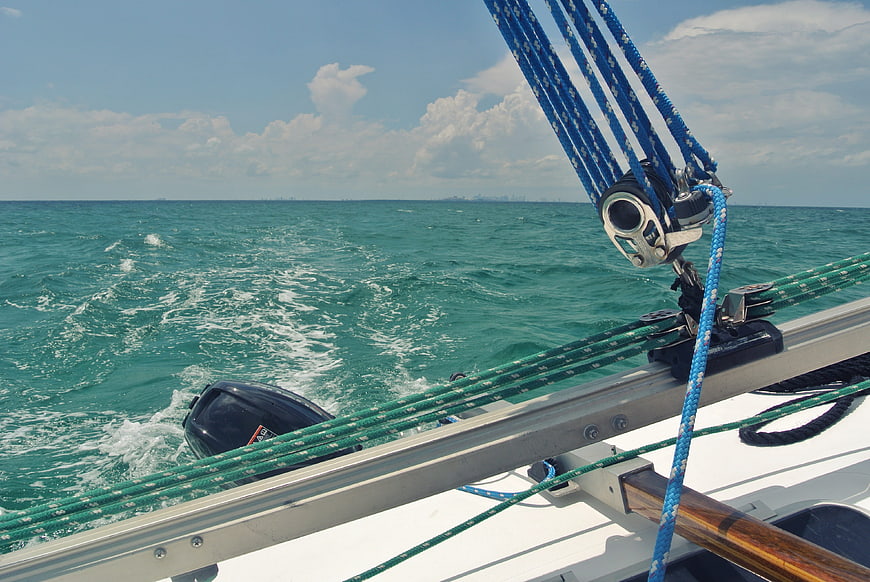 Sailing yacht rigging and turquoise ocean wake