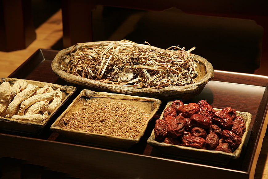 Traditional Chinese Medicine Herbs in Wooden Bowls