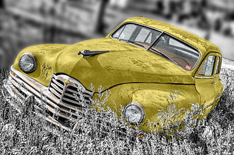Vintage Yellow Car Abandoned in Overgrown Grass