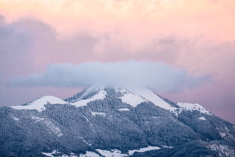 Snow-Capped Mountain Peak with Pink Sunset Sky