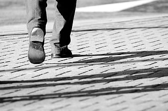 Man Walking On Paved Path Black And White Close Up