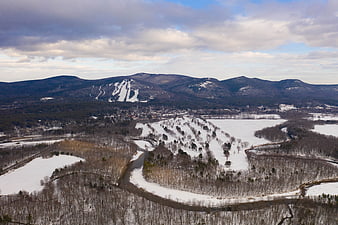 Aerial View of Snowy River Valley and Ski Resort Mountains