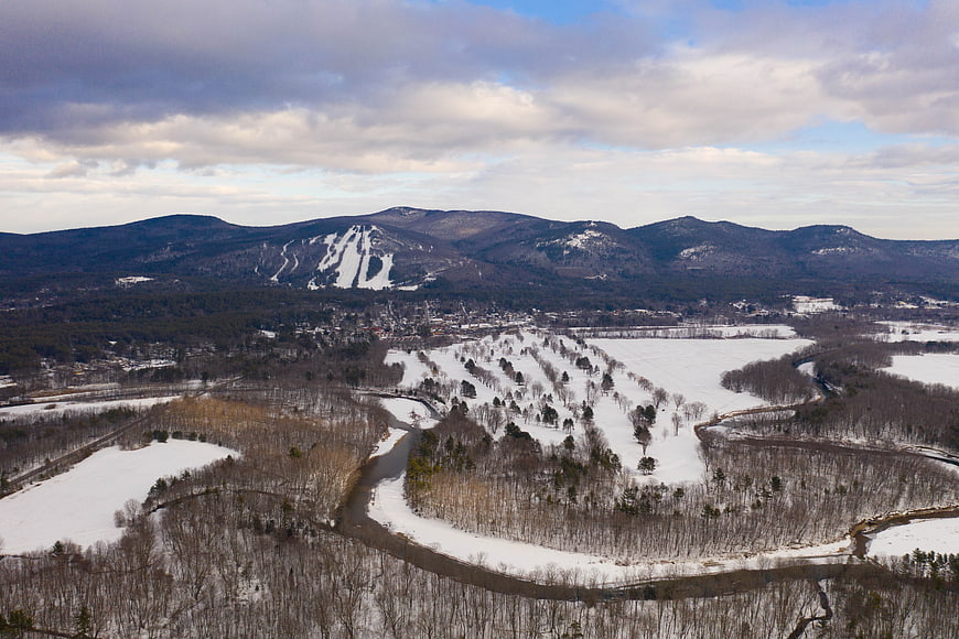 Aerial View of Snowy River Valley and Ski Resort Mountains
