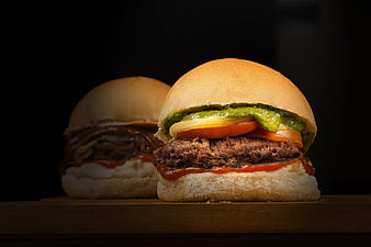 Gourmet Burgers with Fresh Ingredients on Dark Background