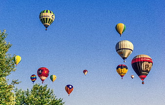 Colorful Hot Air Balloons Floating In Clear Blue Sky