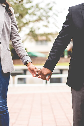 Business Couple Holding Hands Outdoors