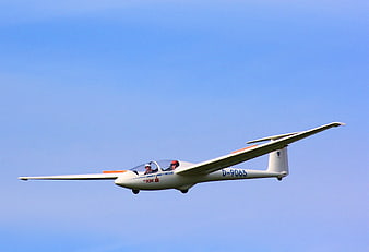 White Glider D-9065 Flying in Blue Sky