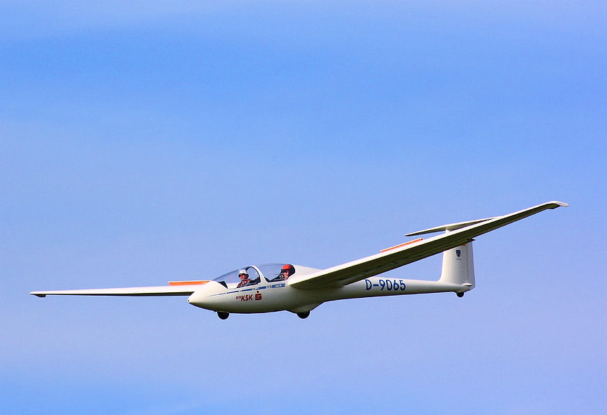 White Glider D-9065 Flying in Blue Sky
