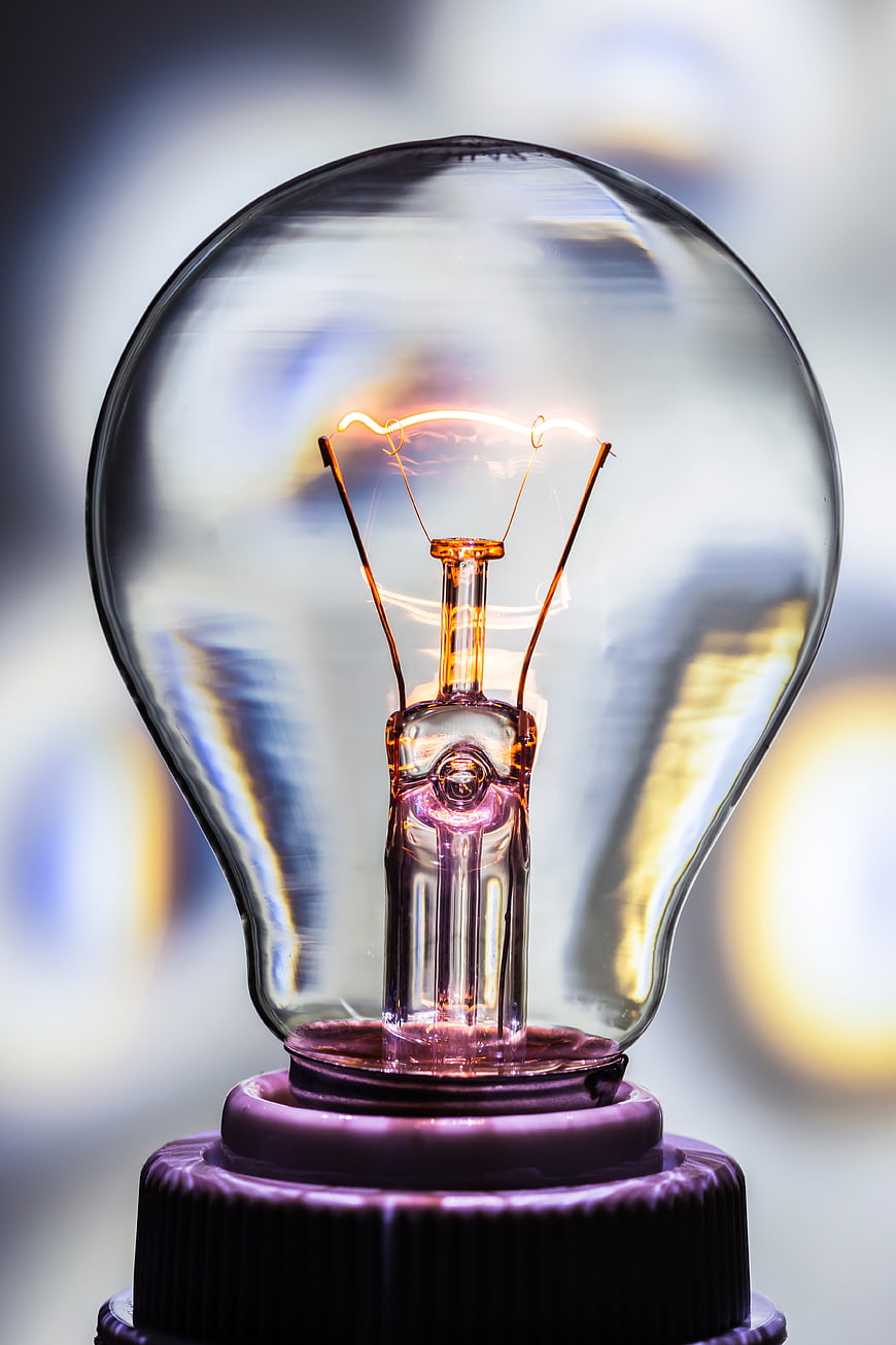 Close-up of glowing incandescent light bulb filament
