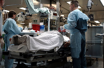 Medical team treating patient in hospital emergency room