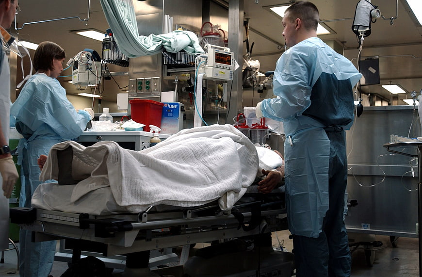 Medical team treating patient in hospital emergency room