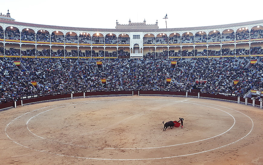Wide angle view of a Spanish bullfight in a large arena