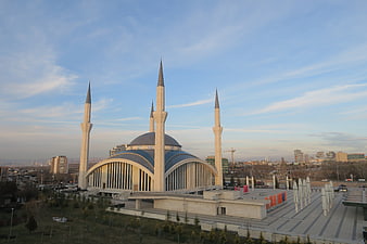 Modern Mosque with Minarets and Blue Sky